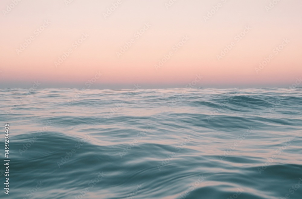 Peaceful sunrise over calm ocean waves, soft pink and orange sky Peaceful sunrise over calm ocean waves, soft pink and orange sky