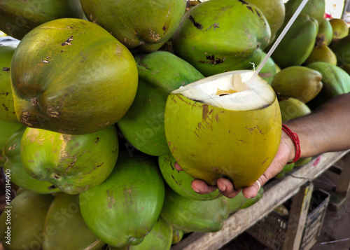 Green Fresh Coconut Drink with Straw Tropical Refreshment Natural Hydration Healthy Summer Beverage