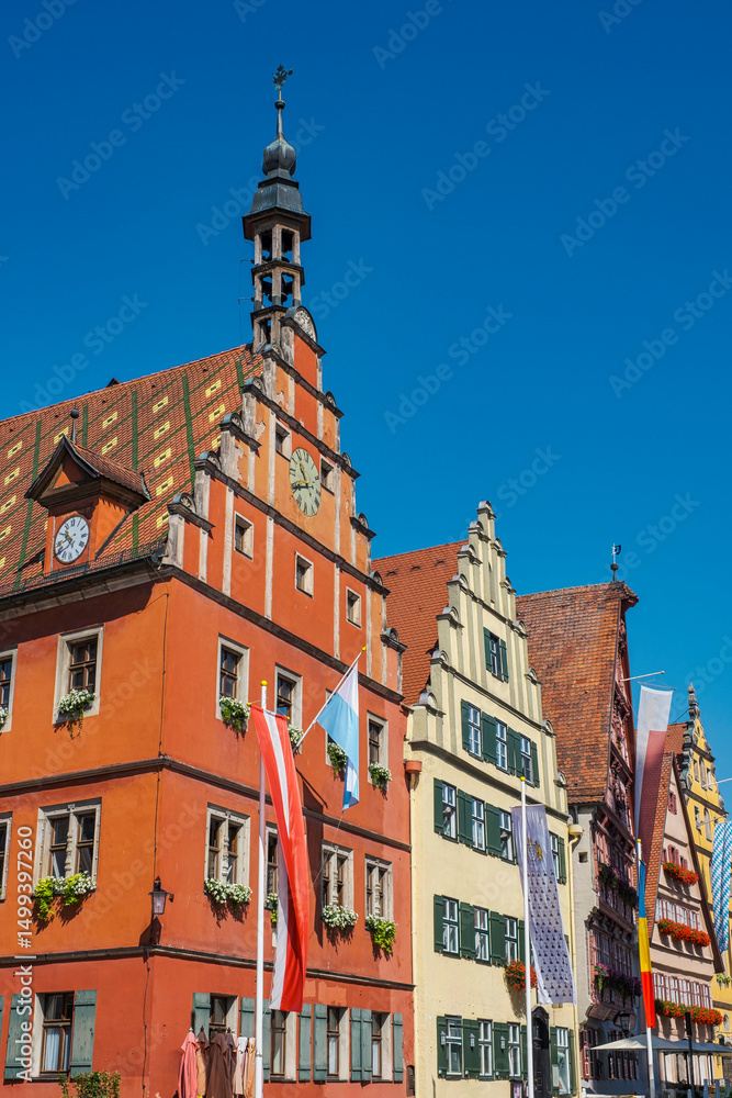 Fototapeta premium Old historic buildings with flags in the old town of Dinkelsbühl