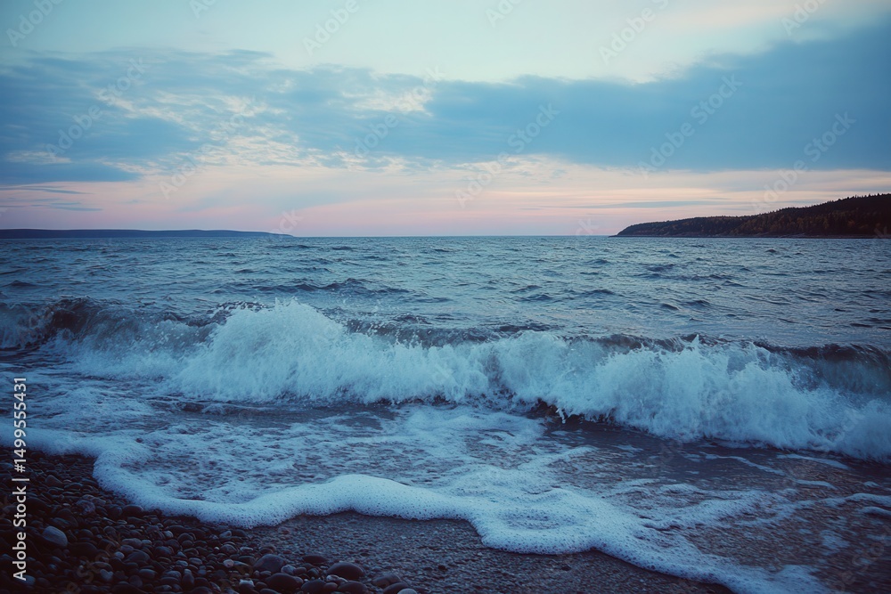 Fototapeta premium Wave breaking on shore at dusk on a white background