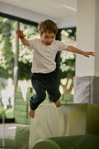 Little boy plating in the indoor kids club.