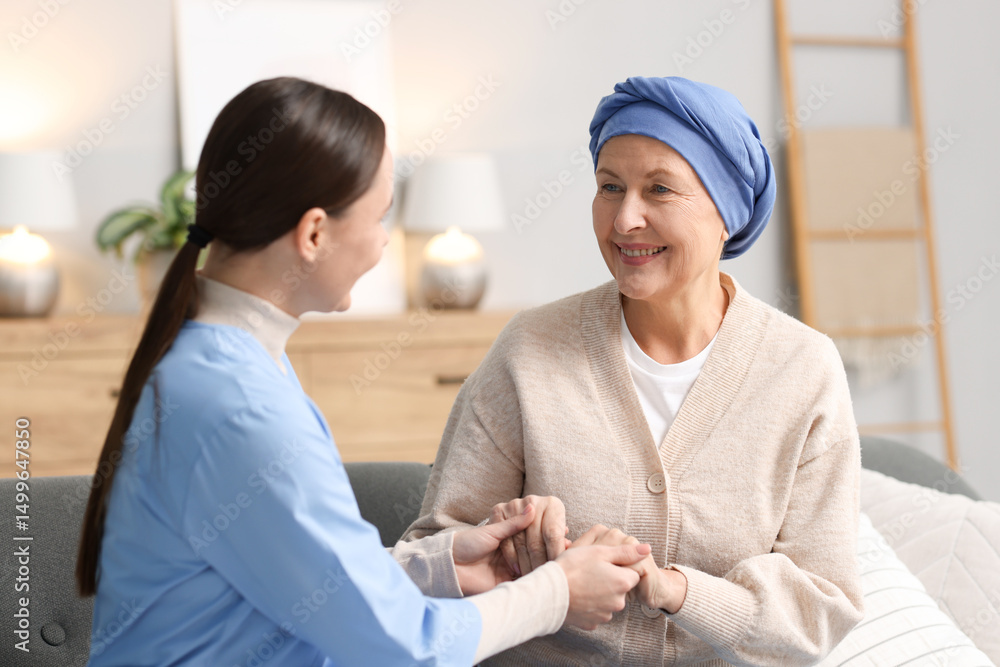 Nurse supporting woman with cancer at home Nurse supporting woman with cancer at home
