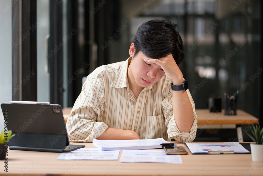 Exhausted employee appearing mentally drained, illustrating pressure, stress, or decision fatigue. Exhausted employee appearing mentally drained, illustrating pressure, stress, or decision fatigue.
