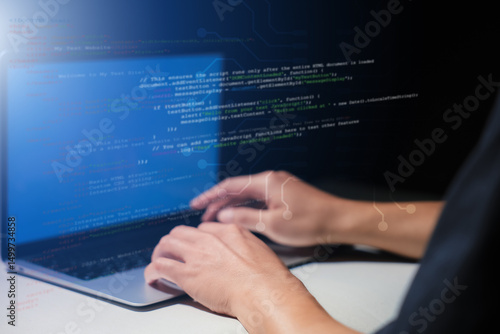 Wallpaper Mural Hands typing on laptop with programming code on screen, representing software development. Perfect for coding, IT solutions, digital technology, web applications. Torontodigital.ca