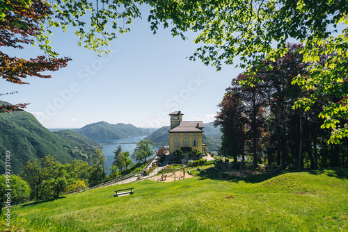 Restaurant sits on top of mountain top, lake and mountains in the distance