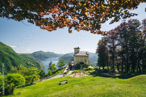 Restaurant sits on top of mountain top, lake and mountains in the distance
