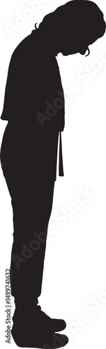  vector; silhouette of a side view of a woman stading and looking down, overall clothes