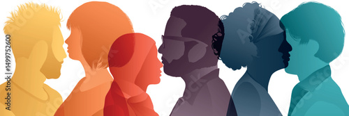 Silhouette of diverse collaborators seen from the side. A harmonious community of colleagues and co-workers in negotiation agreement or pact