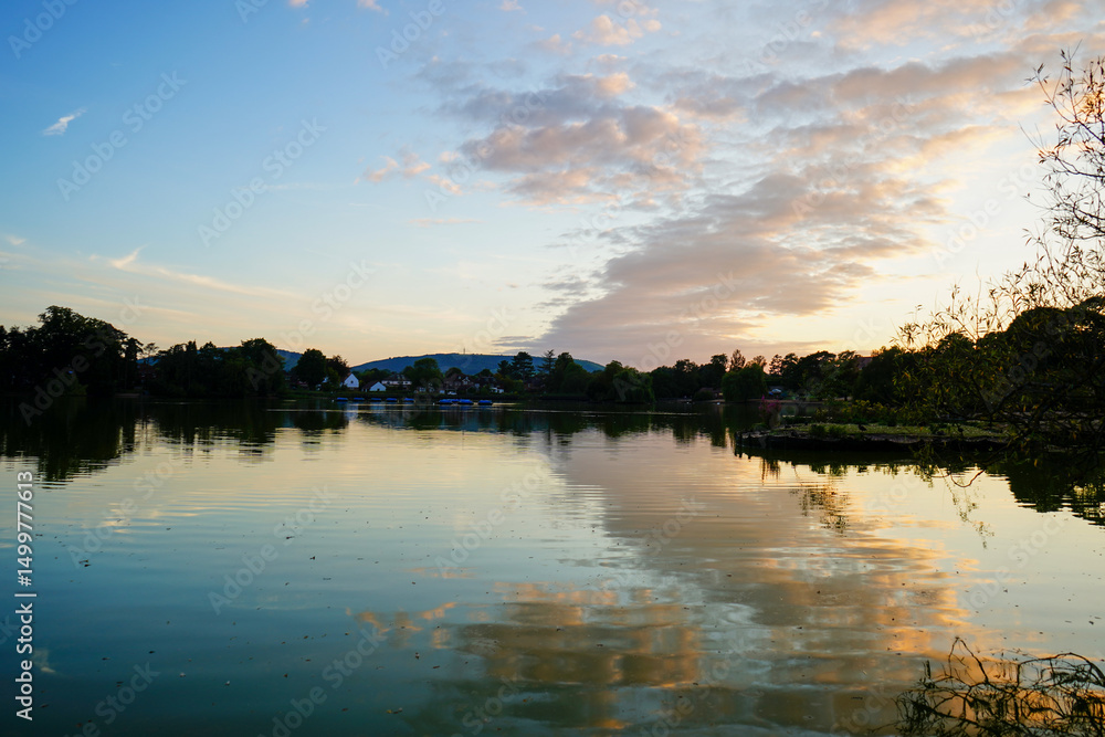 Fototapeta premium Early morning view over a still lake in England