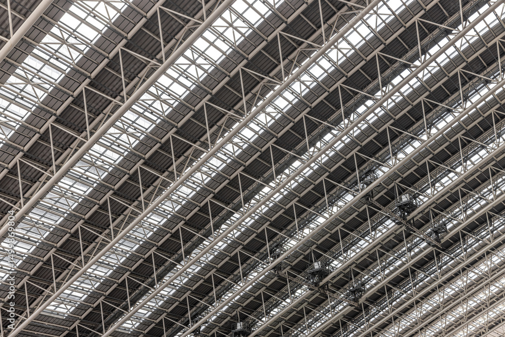Steel beams and glass panels create a repeating pattern in modern architectural Steel beams and glass panels create a repeating pattern in modern architectural