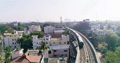 An aerial view of namma metro train moving on railroad track in bangalore,india, railway network