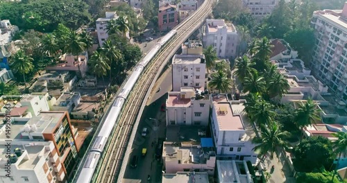 An aerial view of namma metro train moving on railroad track in bangalore,india, railway network