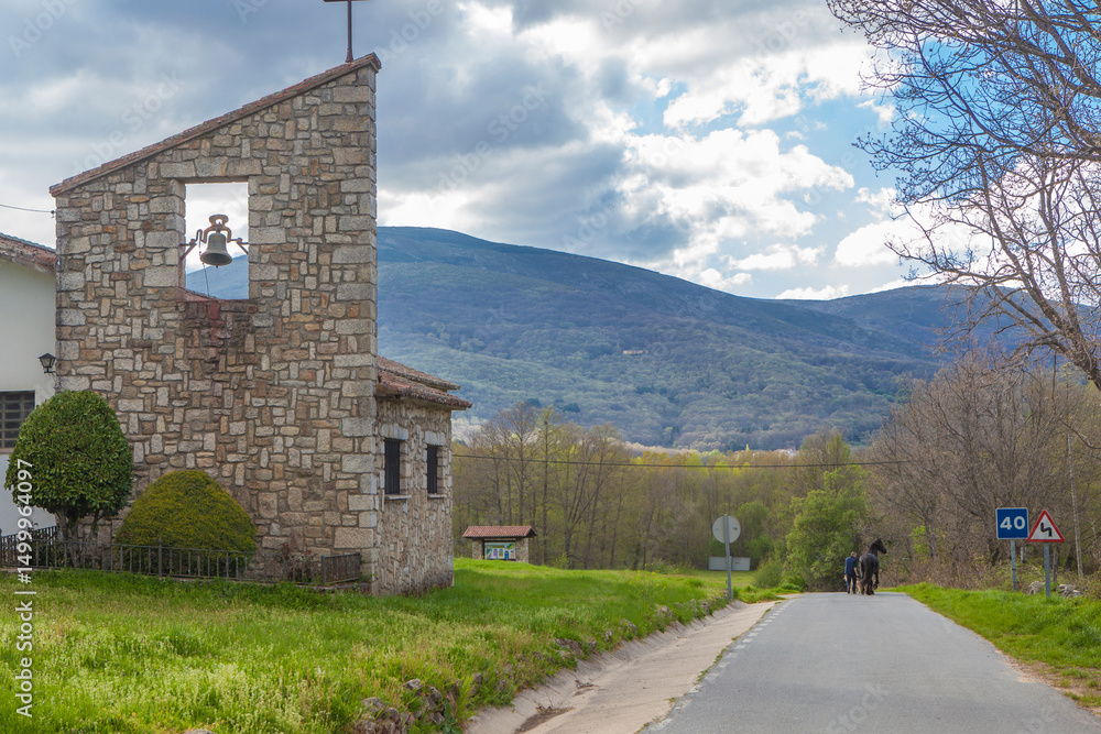 Umbrias town entry, Avila, Castile and Leon, Spain. Visible Friesian black horse