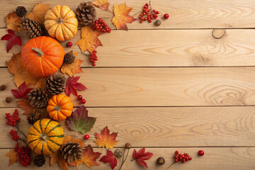 A horizontal image with a corner border of various autumnal gourds