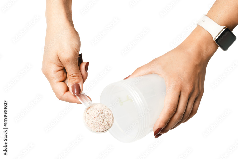 Obraz premium Woman's hands with measuring spoon puts portion of whey protein powder into a shaker, making protein drink cocktail, isolated on transparent background, top view