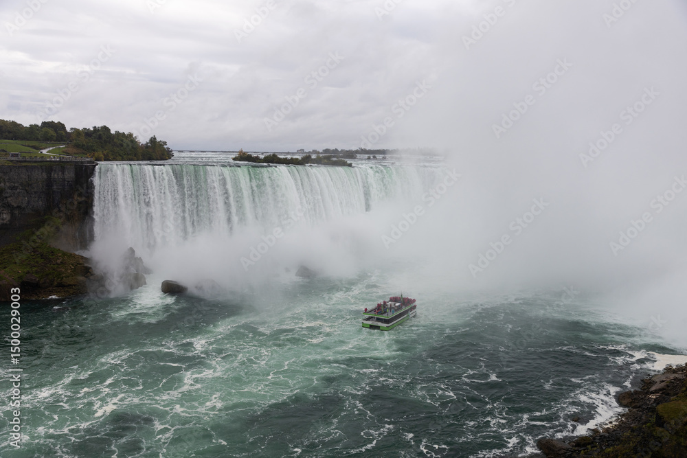 Niagara falls with cruise ship near Horseshoe waterfall in Canada Niagara falls with cruise ship near Horseshoe waterfall in Canada