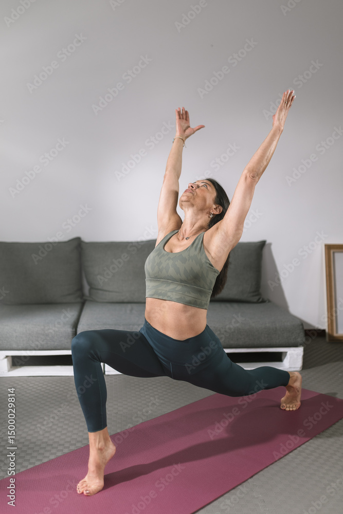 Yoga practice in a cozy living room with a woman demonstrating a pose during a morning routine Yoga practice in a cozy living room with a woman demonstrating a pose during a morning routine