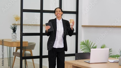 Wallpaper Mural Businesswoman dances in office celebrating successful job office work woman celebrating success joyful office environment. Professional woman dancing in office successful task completion. Torontodigital.ca