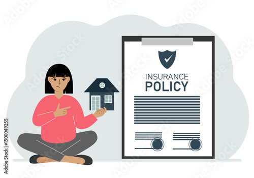 A woman holds in his hands at home next to a large insurance contract. Home and real estate insurance concept.
