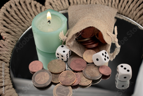 burning candle, dice, coins and a country bag symbolizing luck, fate and mysterious forces that influence financial well-being. themes of prosperity, manifestation of wealth, energy of money