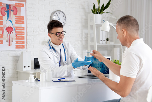 Mature man taking pill at u...