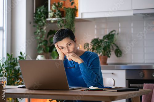 Εκτύπωση καμβά Tired overloaded mature woman with glasses off, look at laptop at home