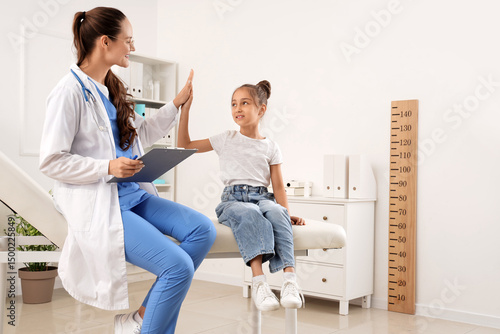 Female pediatrician with li...