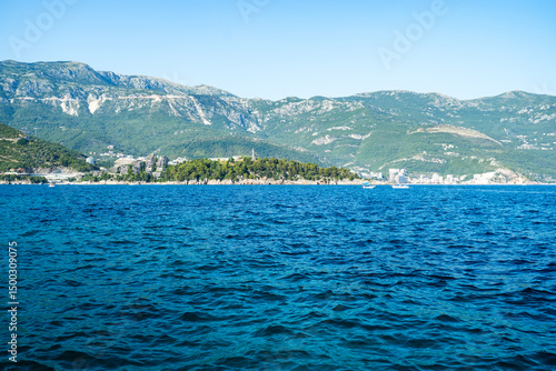 Clear blue Adriatic waters with mountain coastline in the distance