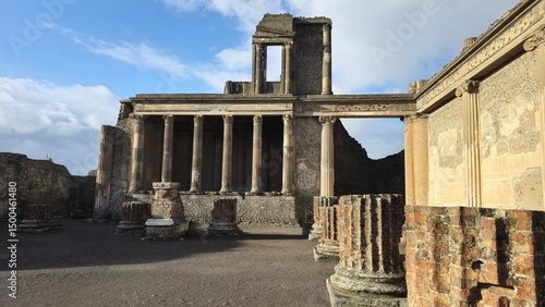 Pompeii, Italy - 8 January 2025. Ruins of the Basilica in Pompeii, Italy, with rows of stone columns and partial walls, once used for legal and business matters in the Roman Forum.