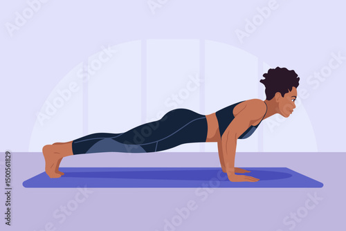Strong woman practicing push-ups indoors in workout attire
