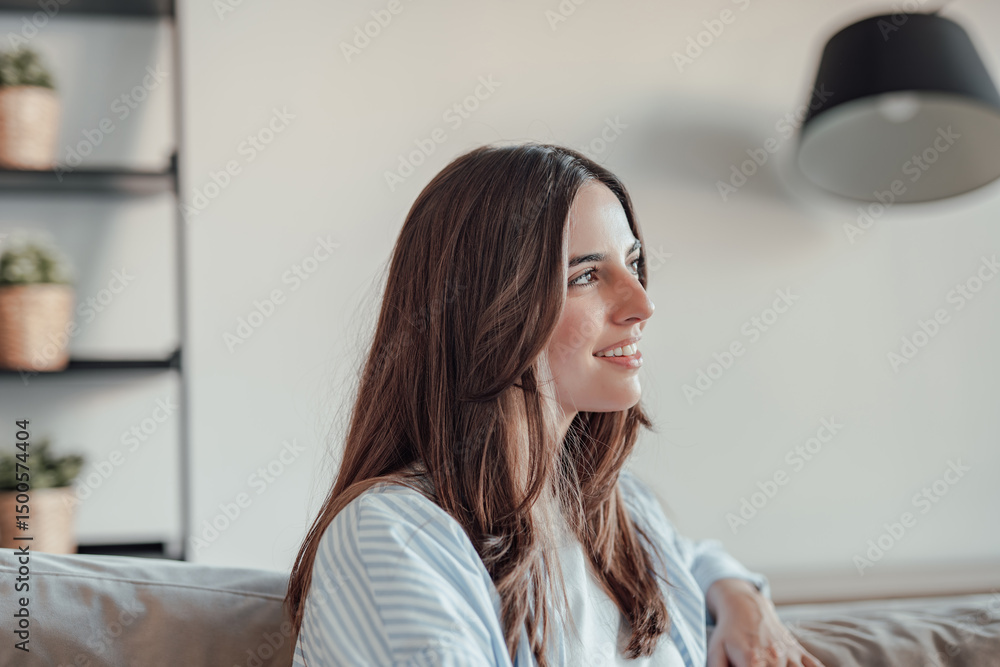Young woman sitting on sofa at home, using phone with varied emotions happy, sad, angry and sometimes experiencing physical discomfort or pain, reflecting real life moments. Young woman sitting on sofa at home, using phone with varied emotions happy, sad, angry and sometimes experiencing physical discomfort or pain, reflecting real life moments.