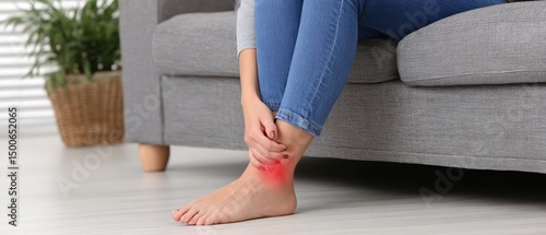 Person experiencing ankle pain highlighted in red.