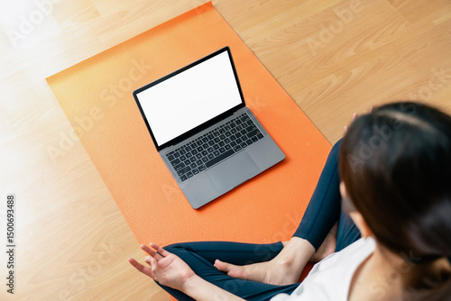 Woman doing exercise yoga plank and blank screen on laptop, for putting advertising to promote.