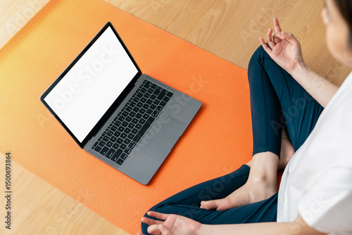 Woman doing exercise yoga plank and blank screen on laptop, for putting advertising to promote.