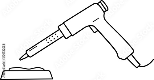 Hot glue gun placed on a stand with adhesive material nearby  
