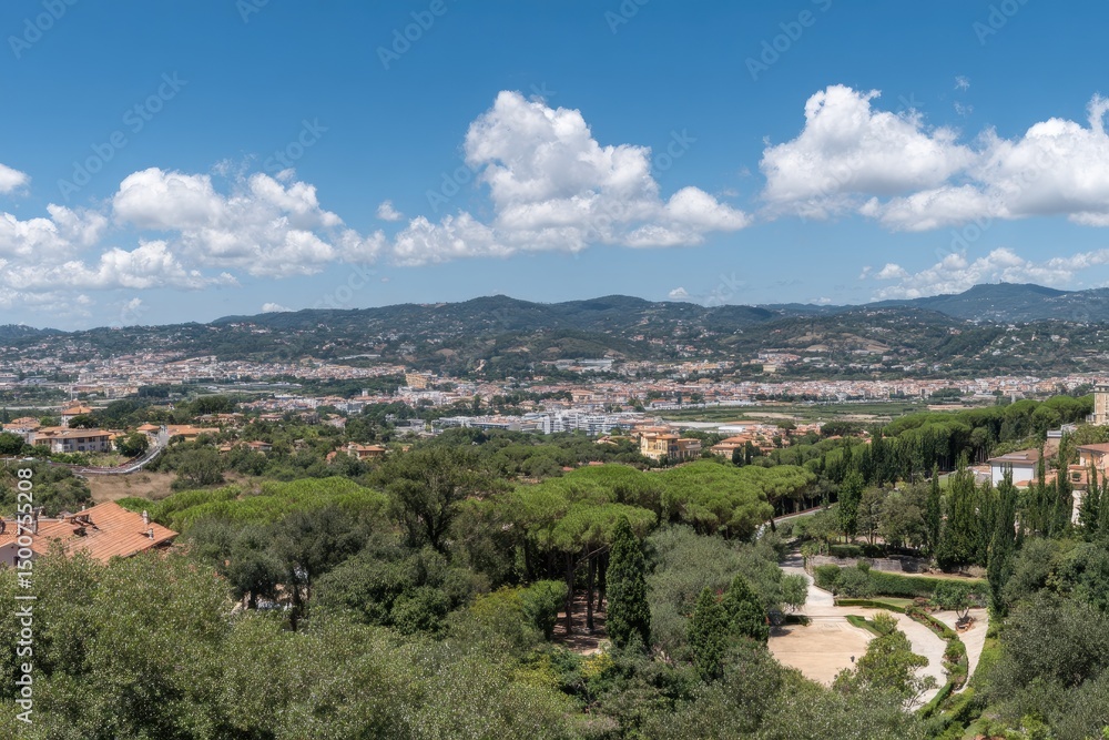 Fototapeta premium Scenic Vista Town Nestled Among Green Mountains