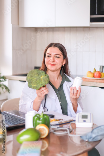 nutritionist demonstrates fresh broccoli and dietary supplements for supporting metabolism and losing weight. dietetics and fitness concept.