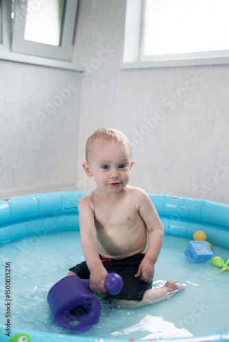 toddler bathes in the pool