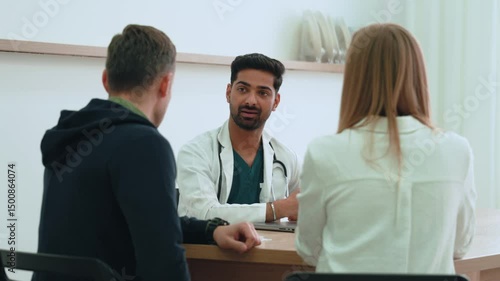 Wallpaper Mural Experienced doctor discussing medical treatment with attentive patient inside clean healthcare setting, highlighting professional medical consultation Torontodigital.ca