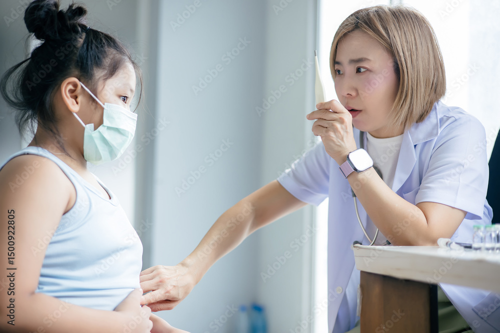 Fototapeta premium Female doctor is examining a child patient's condition