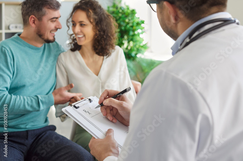 Doctor writing Rx prescription form for young family couple. Happy man and woman together visit medical specialist to do check up tests and receive medication to help improve health and plan pregnancy