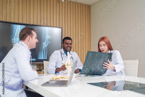 medical team discussing and review rare disease case to improve the practice guidelines,multiracial orthopedic doctors working in medical conference room