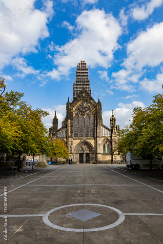 Glasgow cityscape in Scotland, where historic buildings meet modern architecture. The River Clyde flows through the heart of the city, crossed by iconic bridges and surrounded by vibrant urban life.
