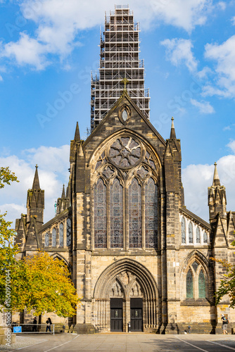 Glasgow cityscape in Scotland, where historic buildings meet modern architecture. The River Clyde flows through the heart of the city, crossed by iconic bridges and surrounded by vibrant urban life.