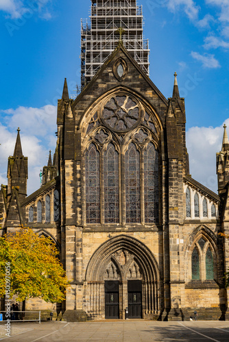 Glasgow cityscape in Scotland, where historic buildings meet modern architecture. The River Clyde flows through the heart of the city, crossed by iconic bridges and surrounded by vibrant urban life.