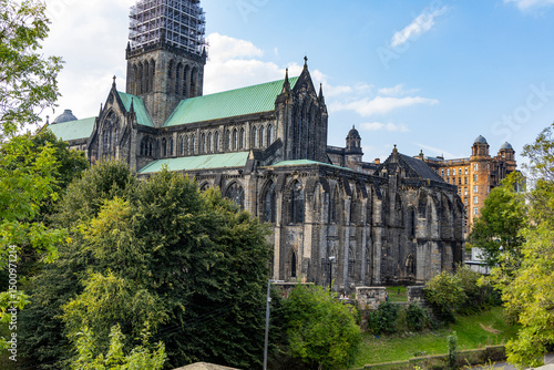 Glasgow cityscape in Scotland, where historic buildings meet modern architecture. The River Clyde flows through the heart of the city, crossed by iconic bridges and surrounded by vibrant urban life.