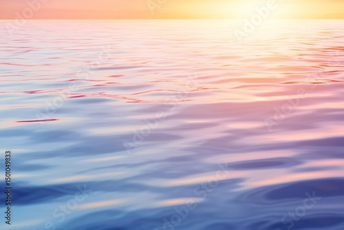 Calm water surface reflecting soft colors of sunset scenery