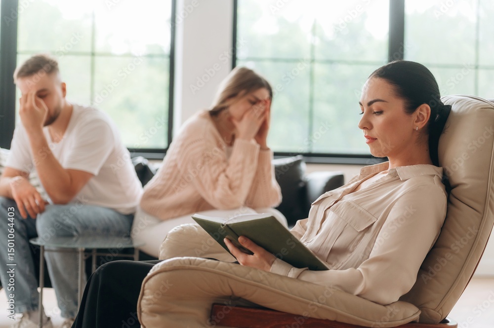Woman is crying. Couple are at psychologist appointment Woman is crying. Couple are at psychologist appointment