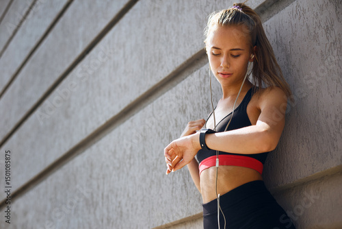 Fit woman work out outdoor with smart watch