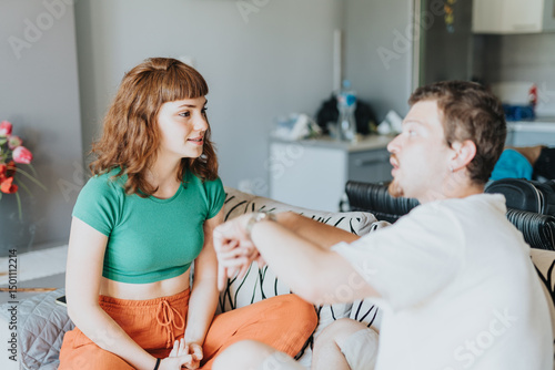 Two friends discuss with enthusiasm in a modern apartment, conveying connection, earnestness, and a relaxed social environment